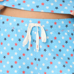 Bay blue pajama pants with patriotic red white navy star print and drawstring waist