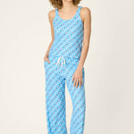 Woman wearing light blue pajama set with patriotic star print tank and pants