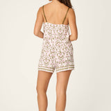 Model wearing PJ Salvage Tiki Time Short PJ Set in pink and green tropical print, back view