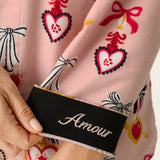 Close-up of PJ Salvage Love Lockets flannel sleeve cuff with black Amour embroidery detail