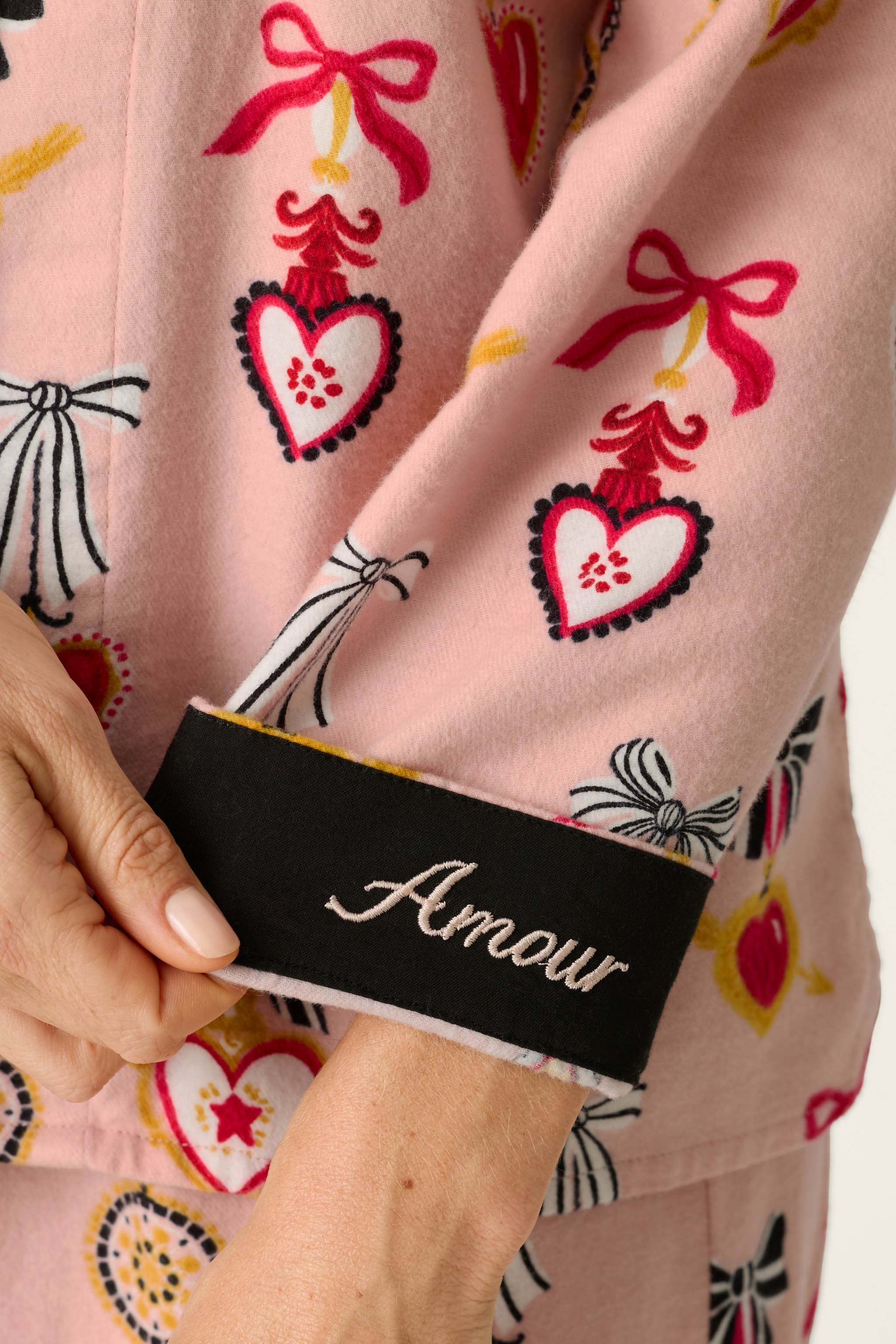 Close-up of PJ Salvage Love Lockets flannel sleeve cuff with black Amour embroidery detail