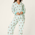Woman wearing PJ Salvage mint striped espresso martini print long sleeve flannel pajama set with headband