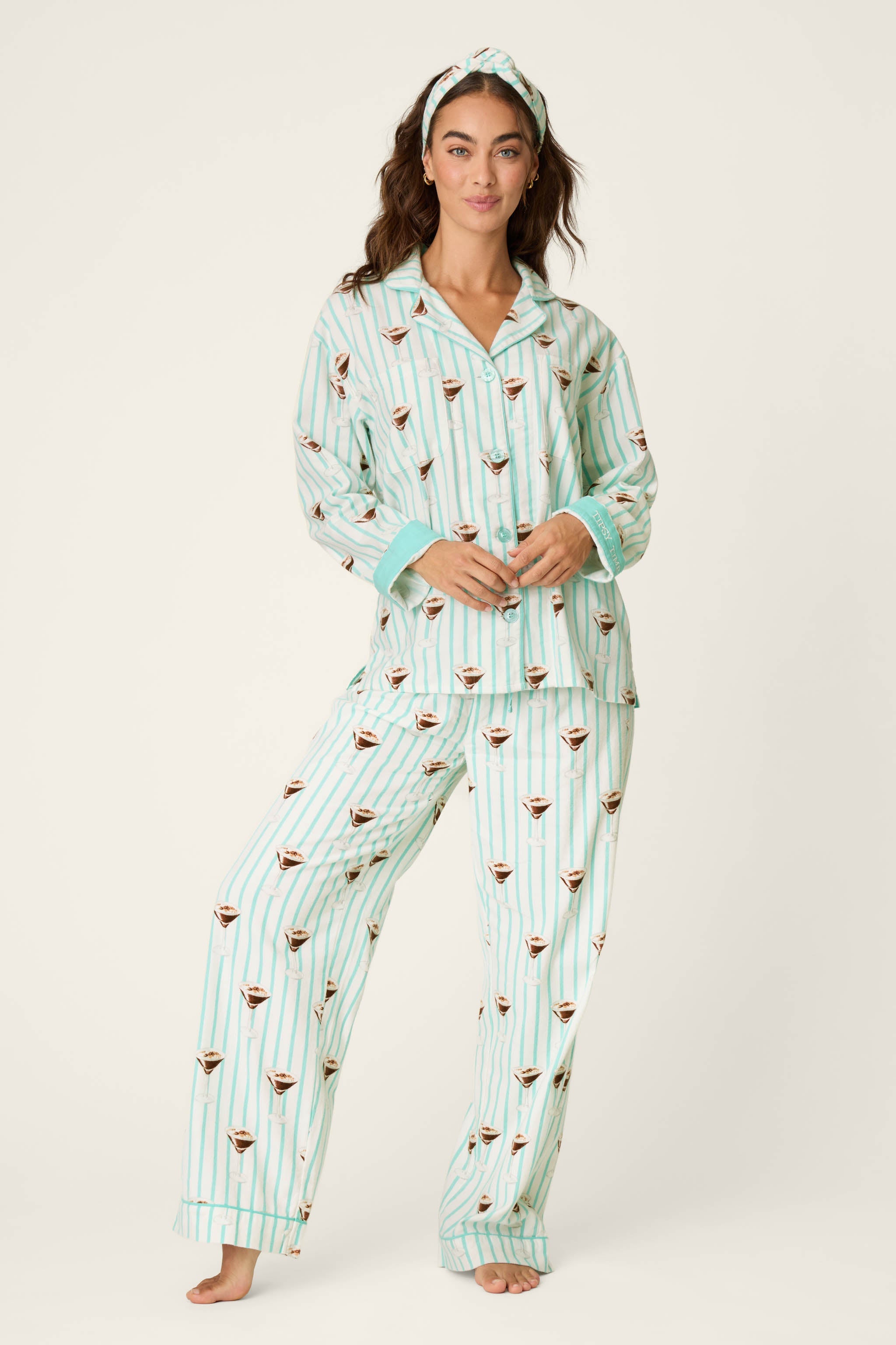 Woman wearing PJ Salvage mint striped espresso martini print long sleeve flannel pajama set with headband