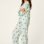 Woman wearing mint striped espresso martini print long sleeve flannel PJ set with eye mask