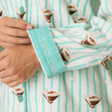 Close-up of PJ Salvage flannel pajama cuff embroidered with Tipsy Time text, espresso martini print