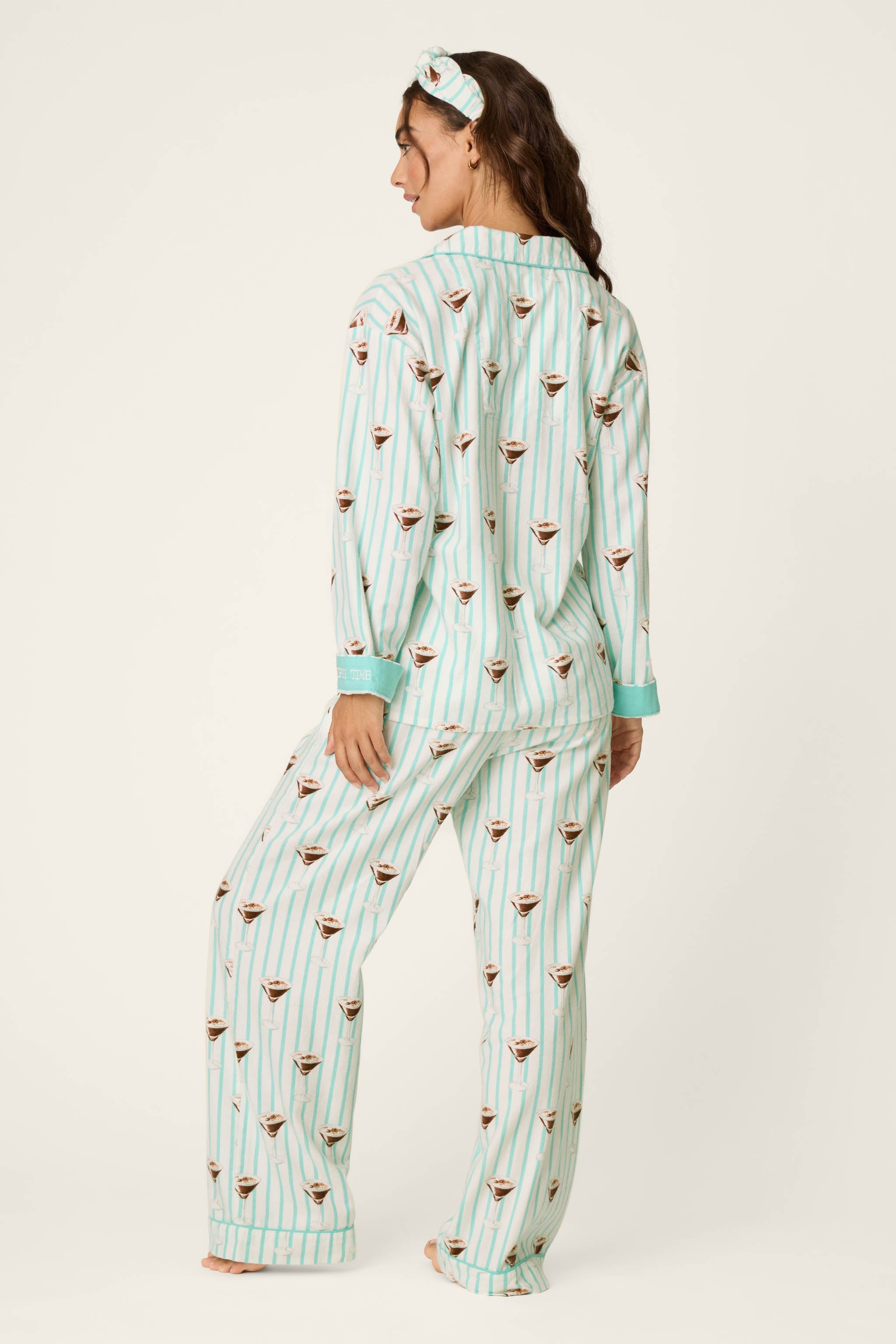 Woman modeling PJ Salvage espresso martini print teal striped three-piece flannel pajama set, back view