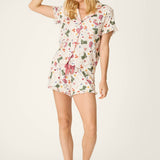 Woman wearing PJ Salvage Saddle Up Western Print nude 3-piece pajama set with eye mask