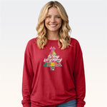 Woman wearing red long sleeve tee with colorful Christmas tree So Very Merry graphic