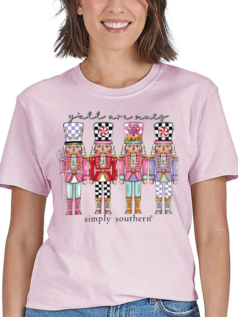 Simply Southern Y'all Are Nuts Nutcracker graphic tee in peony pink on smiling model