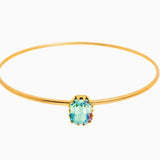 Tova Ada Bangle gold thin band bracelet featuring a light turquoise emerald-cut crystal stone