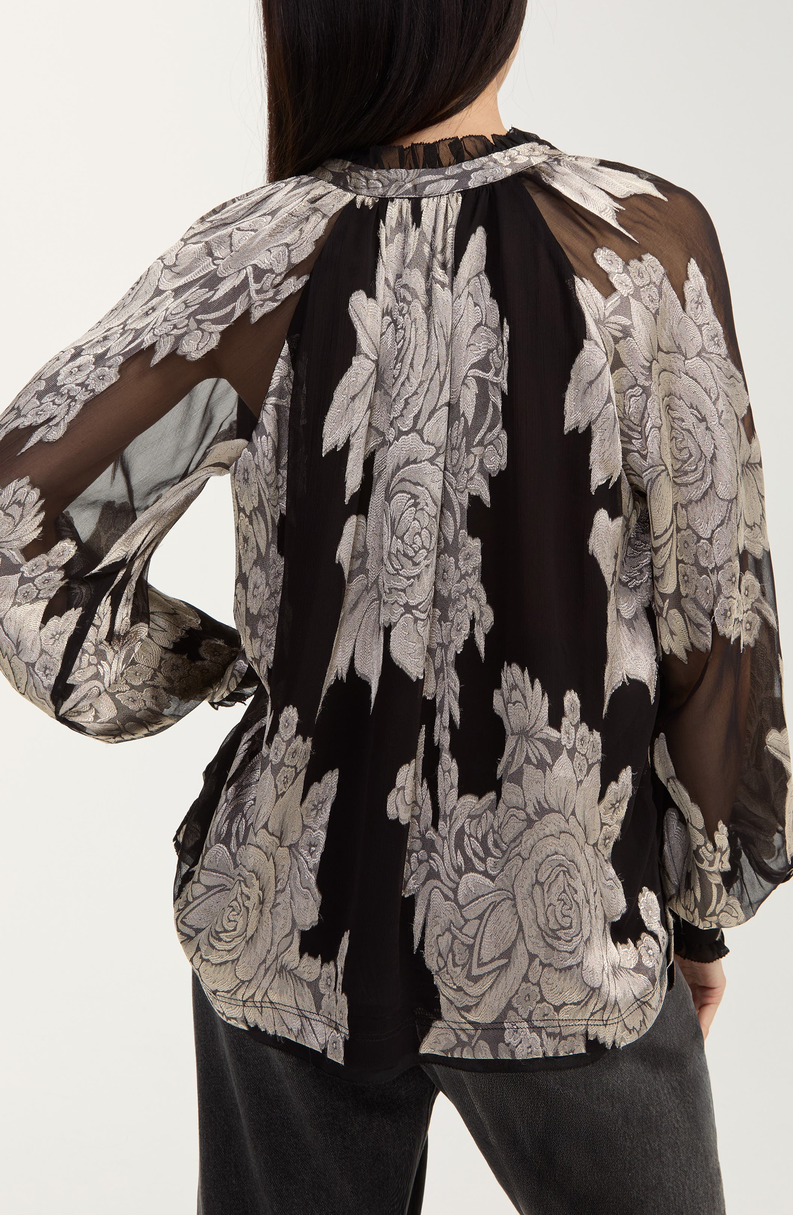 Back view of black chiffon jacquard top with floral print and sheer sleeves
