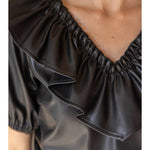 Ruffle V Neck Faux Leather Top in black at ooh la la in Grapevine TX 76051