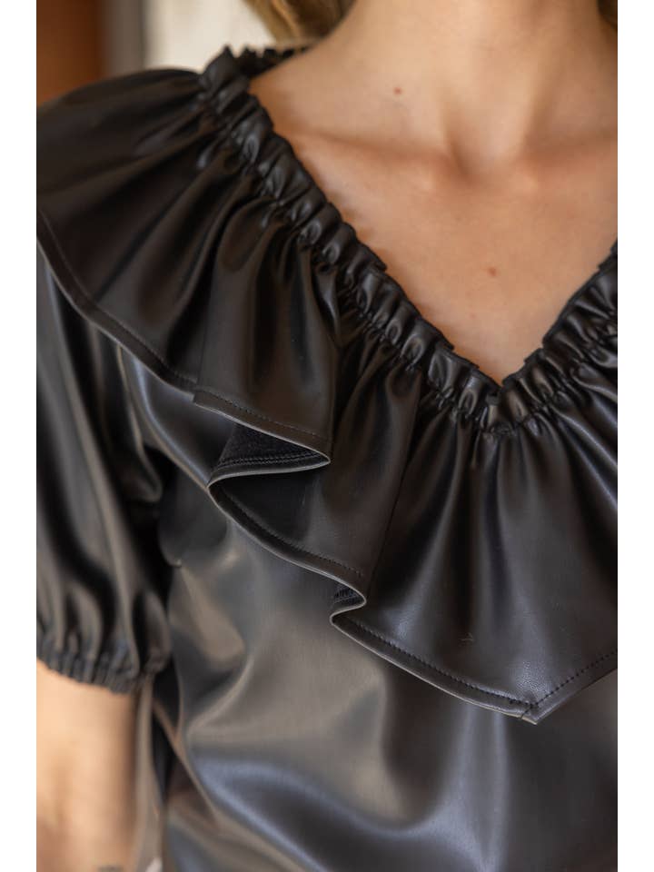 Ruffle V Neck Faux Leather Top in black at ooh la la in Grapevine TX 76051