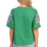 embroidered linen top, bubble sleeve blouse, green floral top, resort wear for women, v-neck summer blouse, pink and green top, botanical embroidery clothing, puff sleeve linen shirt at ooh la la! in Grapevine TX 76051