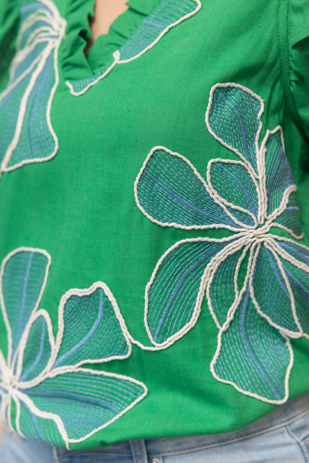 Floral embroidered top, green ruffle blouse, V-neck summer top, women's boho clothing, embroidered floral shirt, ruffle sleeve top, woven summer blouse.
ooh la la! in Grapevine TX 76051