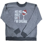 Distressed dark gray crewneck sweatshirt featuring a holiday graphic in white and red that reads "HO HO HOLY SH*T I'M DRUNK." The asterisk in the word is replaced by a small candy cane, and a wine glass wearing a Santa hat is printed next to the text.