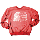 Heathered red crewneck sweatshirt featuring a white graphic print of Dolly Parton next to the text "Have A Holly Dolly Christmas," with holly leaf accents.