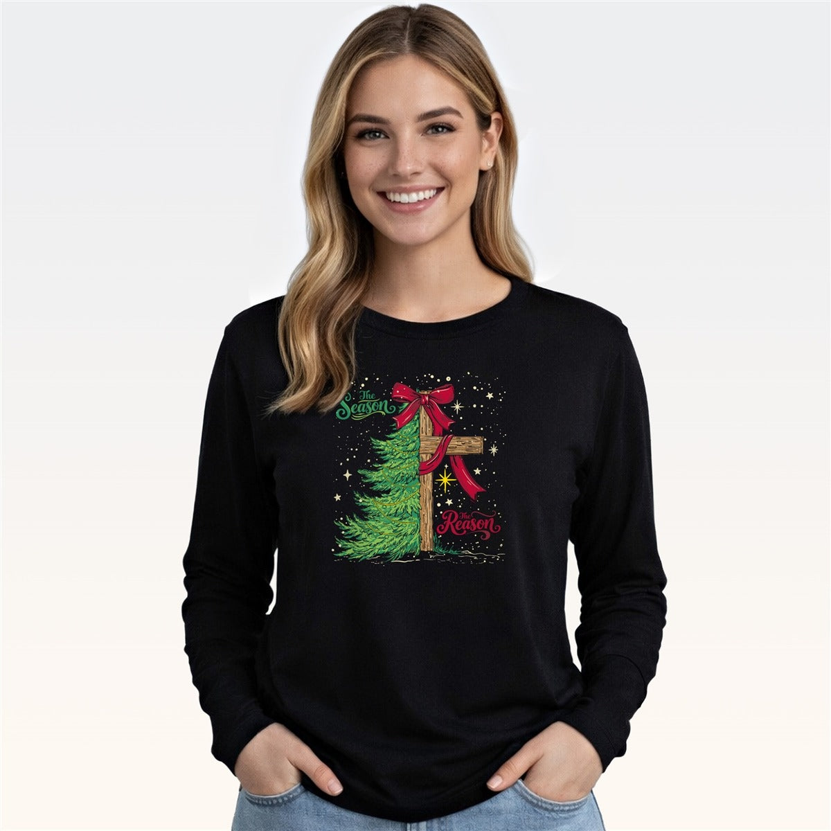 Woman wearing black long sleeve tee with Christmas tree and cross graphic design