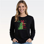 Woman wearing black long sleeve tee with Christmas tree and cross graphic design
