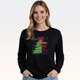 Woman wearing black long sleeve tee with Christmas tree and cross graphic design