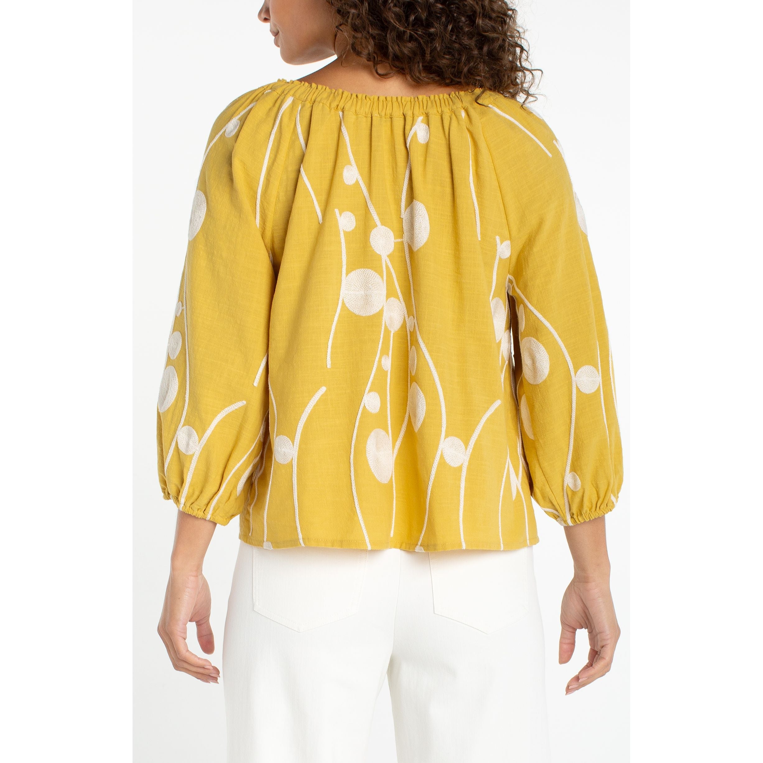 Yellow 3/4 sleeve top with cream floral embroidery and gathered neckline