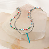 Brighton Meridian Petite Multi Color Necklace with silver beads and turquoise pendant on crystal display