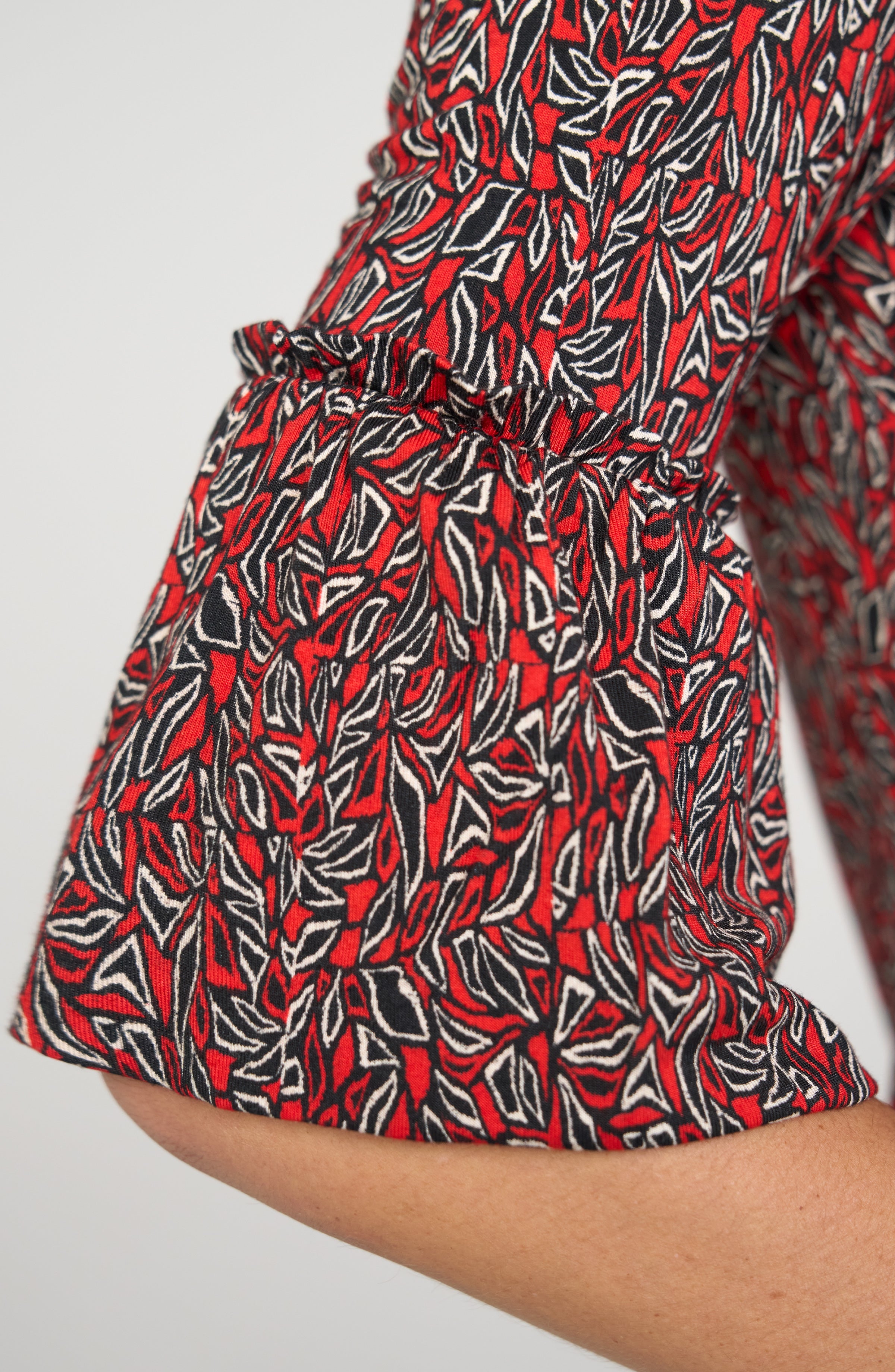 Liverpool Red Geo-Print Flared Half Sleeve Knit Top at ooh la la! in Grapevine TX 76051