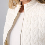 Liverpool cream cable-knit reversible zip-front sweater vest on female model, close-up detail view