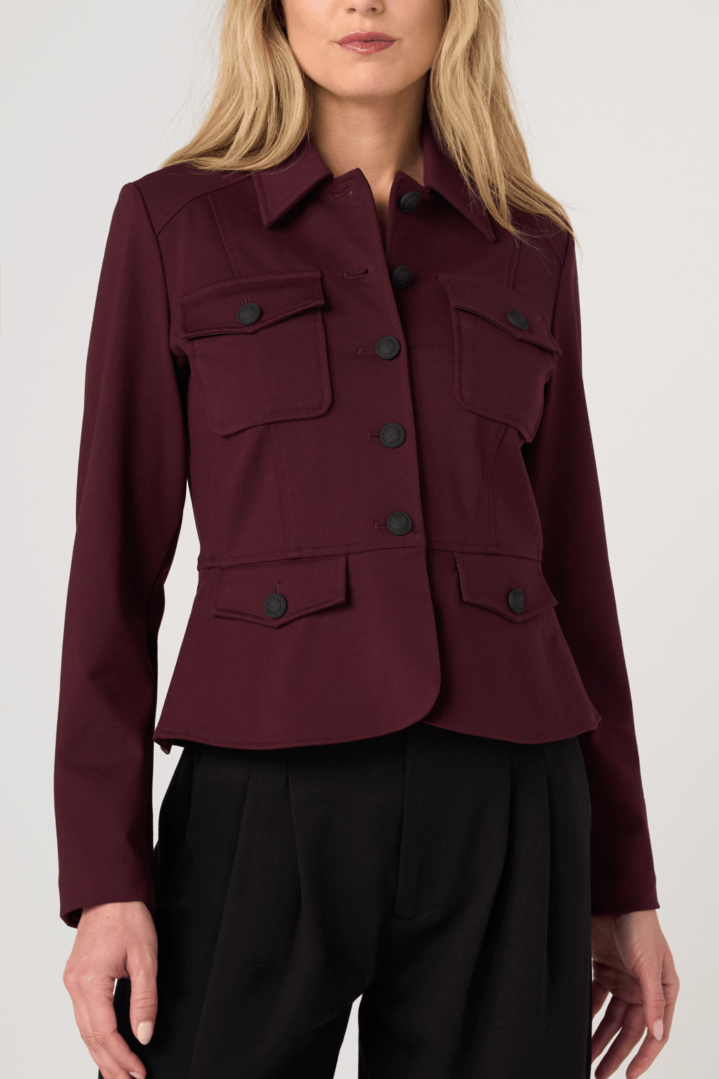 Liverpool Peplum Jacket in dark oxblood with military-style buttons and patch pockets