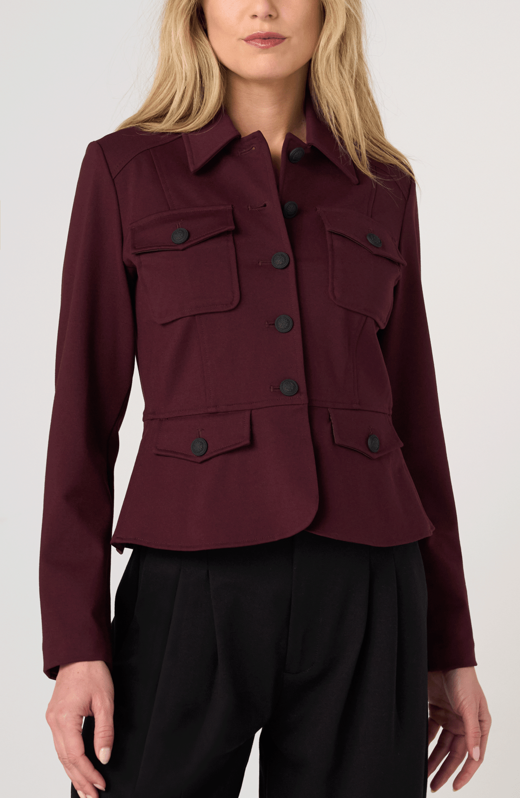 Liverpool Peplum Jacket in dark oxblood with military-style buttons and patch pockets