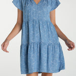 Liverpool Los Angeles, denim dress, floral mini dress, tiered dress with pockets, indigo roses, summer flutter sleeve dress, light wash denim dress, feminine casual style. at ooh la la! in 
Grapevine TX 76051
