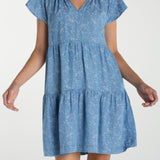 Liverpool Los Angeles, denim dress, floral mini dress, tiered dress with pockets, indigo roses, summer flutter sleeve dress, light wash denim dress, feminine casual style. at ooh la la! in 
Grapevine TX 76051