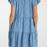 Liverpool Los Angeles, denim dress, floral mini dress, tiered dress with pockets, indigo roses, summer flutter sleeve dress, light wash denim dress, feminine casual style. at ooh la la! in 
Grapevine TX 76051